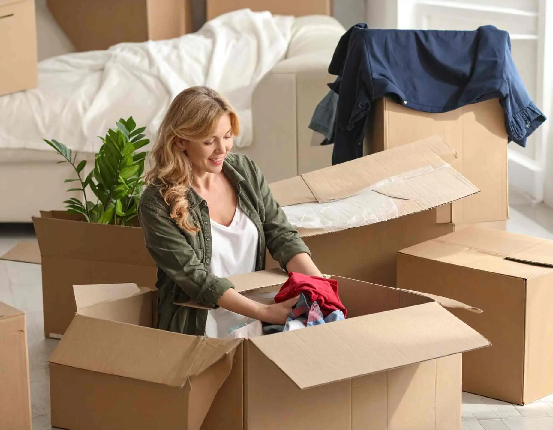 Woman Packing Clothes to move